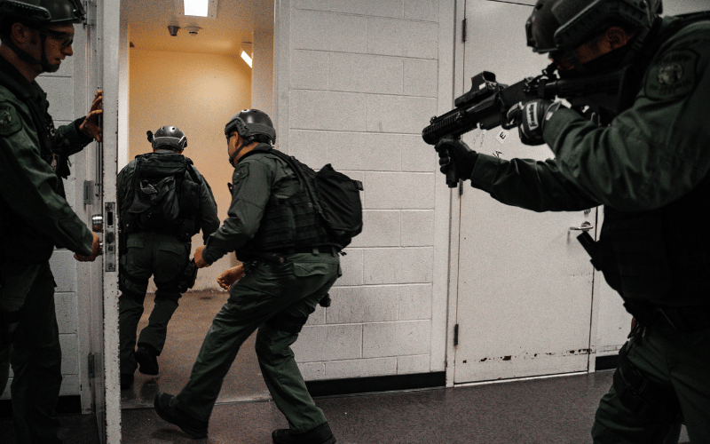 Members of the San Joaquin County Sheriff's Custody Emergency Response Team prepare to enter a cell