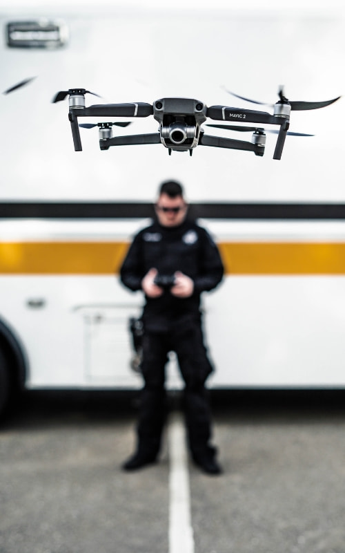 A San Joaquin County Sheriff's Deputy controls a drone via remote control